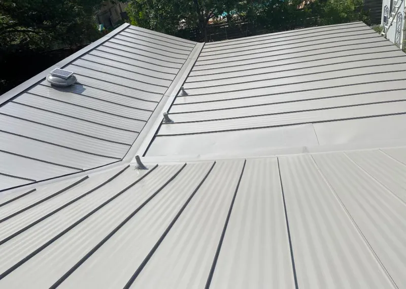 Solar attic fan installed on a metal roof for Roof Ventilation in St. Charles